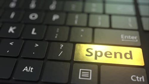 Black Computer Keyboard and Gold Spend Key