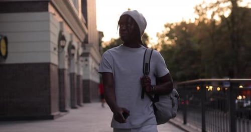 African American Man Walking in a City Street Slow Motion
