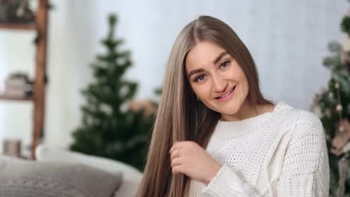 Smiling Woman with Long Hair in Christmas Home