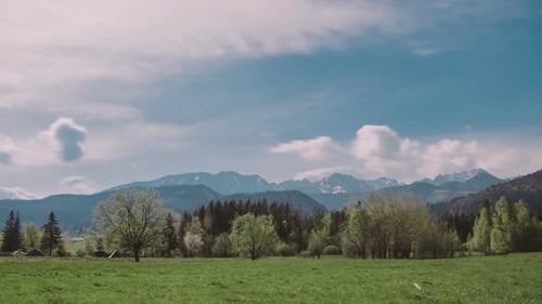 Mountain Peaks and Morning Sky with Smooth Moving Clouds