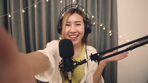Smiling Woman Recording Podcast at Home