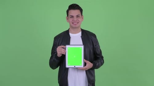 Young Adult Holding Tablet with Green Screen