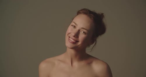 Smiling Woman Posing in Studio