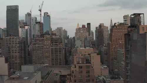 Flight Through Manhattan Skyscraper Canyon New York City Busy Street Lights at Dusk