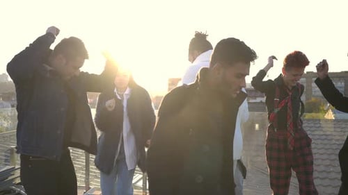 Friends Dancing on Rooftop in the City
