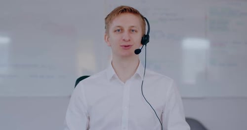 Man with Headset Talking in Modern Office