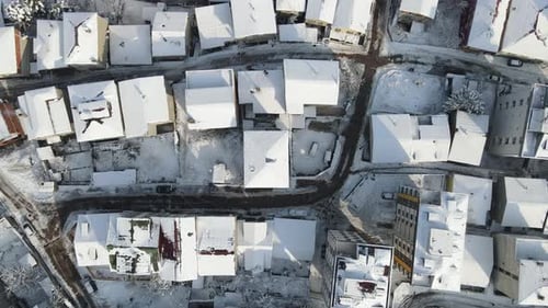 Snow Covered Neighborhood Aerial View in Winter