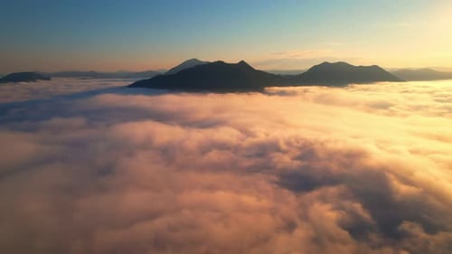 4K Sun is rising above sea of clouds until the horizon