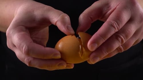 The cook reveals a broken raw egg.