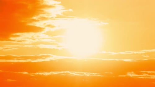 Vibrant Sunset with Clouds and Golden Sunlight