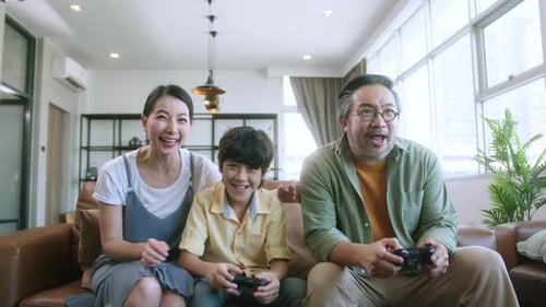Family Play Video Games Together in Living Room