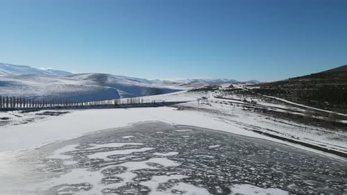 Drone Over Frozen Lake in Winter