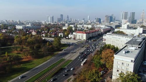 large road crossing near Warsaw City Centre, modern architecture meets old Town buildings, dense tra