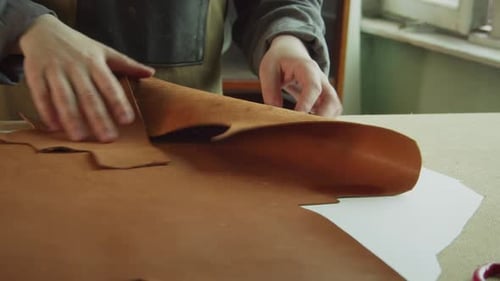 Hands of a Master Tailor Close-up Without a Face. Pattern for Making Women's Bags Made of Genuine