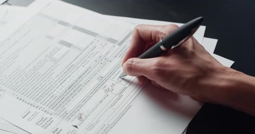 Woman Filling In The Tax Form