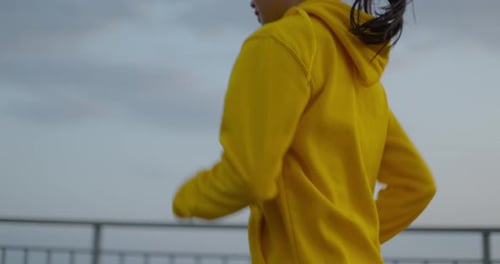 Young Woman Running In The Park