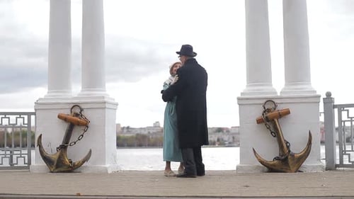 Senior man and woman dancing together in the park. The concept of a healthy lifestyle.