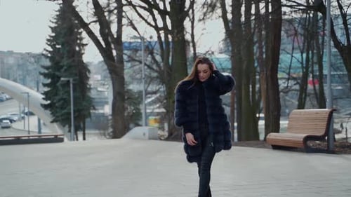 Stylish Woman Walking in an Urban Park