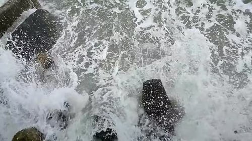 Waves break about Pier