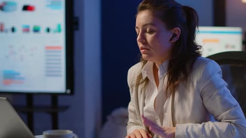 Employee Having Video Conference Working Overtime From Business Office