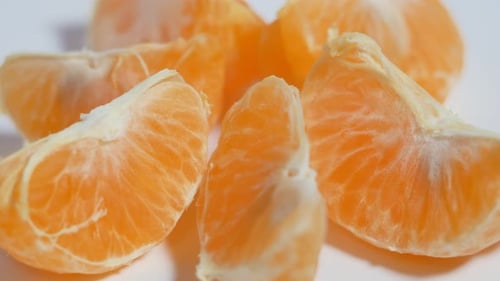 Tangerine Slices on a Rotating Table