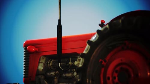 Vintage Red Tractor Closeup with Smooth Camera Pan