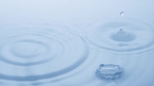Water Droplets Create Abstract Ripples and Splash
