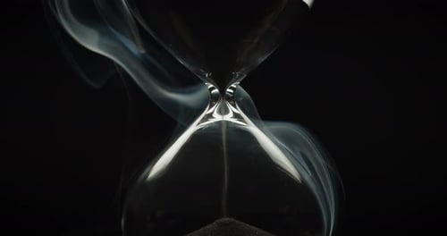 Elegant Hourglass with Sand Falling and Smoke