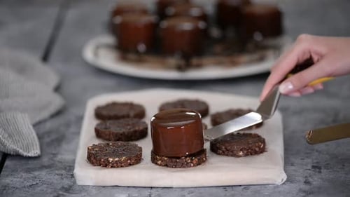 Assembling Elegant Chocolate Cookie Cakes at Home