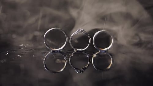 Three Wedding Rings under Gentle Rain