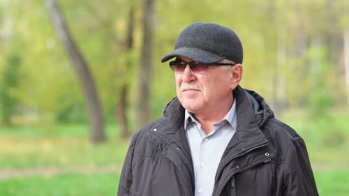 Senior Man with a Mustache in the Park
