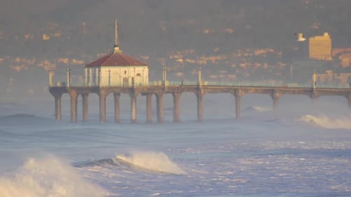 The Manhattan Beach Pier stands majestic over the Pacific Ocean.