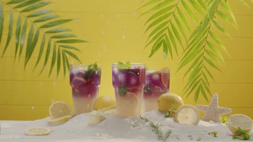 Refreshing Tropical Drinks on a Sandy Surface