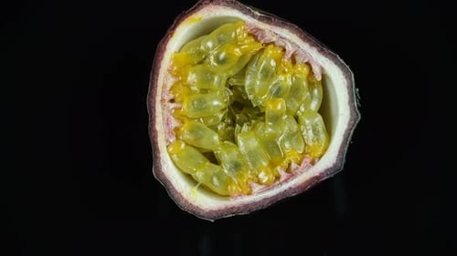 Close Up of Rotating Passion Fruit Half