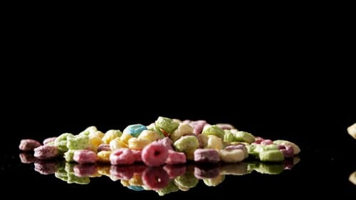 Froot loops on black background 4k
