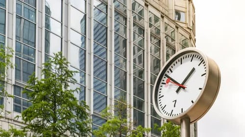Time Lapse of Clock and Office Building