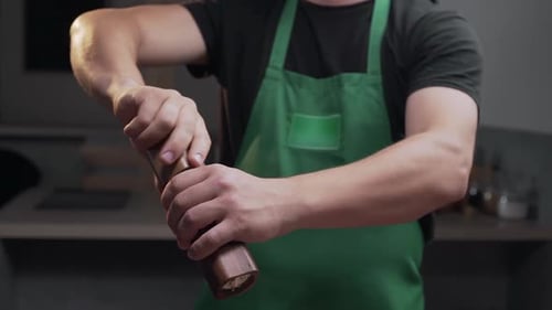 Chef Uses Salt Mill To Add Some Salt for His Meal, Salt Falls in Slow Motion, Milling the Salt