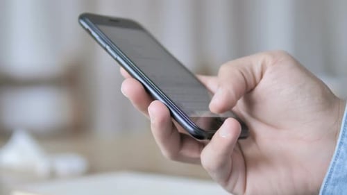 Hand using Smartphone Touch Screen Technology