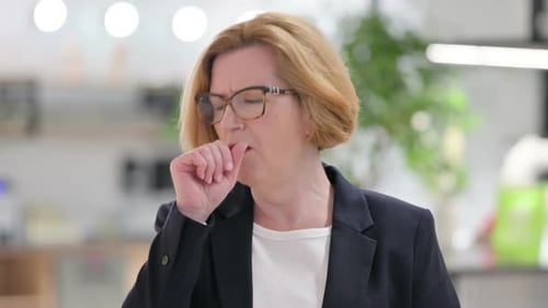 Portrait of Sick Old Businesswoman Coughing