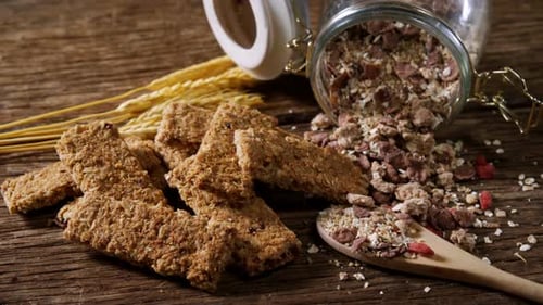 Delicious Cereal Bars with Granola and Wheat on Table