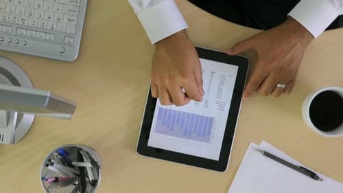 Analyzing Business Data on Tablet in the Office