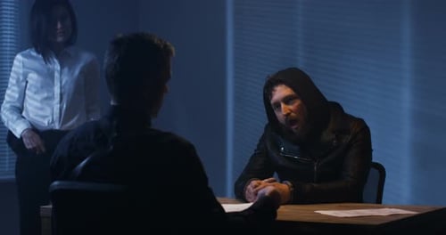 Investigators Interrogating a Criminal