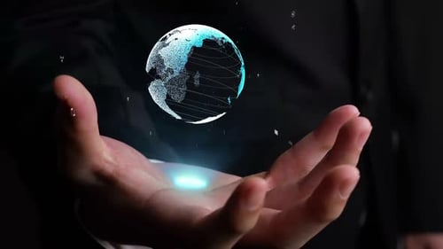 Holographic Globe Floating Above Open Hand