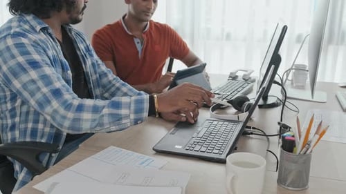 Male Colleagues Coworking in Office