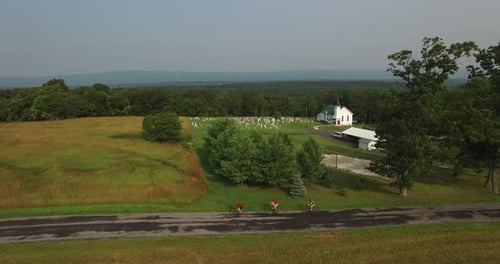 Aerial View of Cyclists Riding Country Road