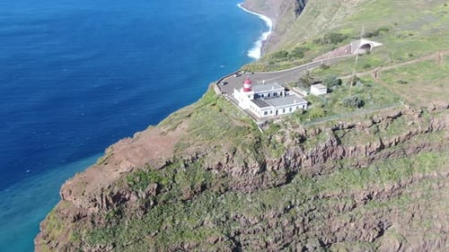 Flying over Ponta do Pargo lighthouse, built on a cliff, Madeira, Portugal