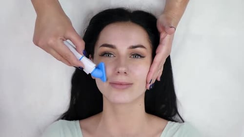 Woman Receiving a Facial Treatment Close Up