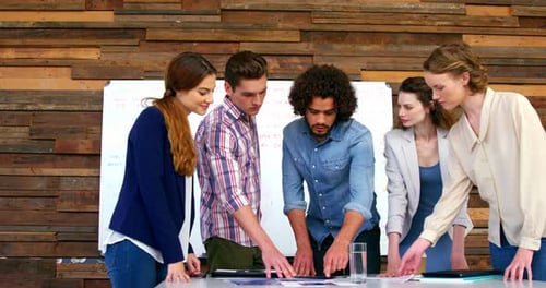 Young Adults Collaborating in Rustic Workplace Office
