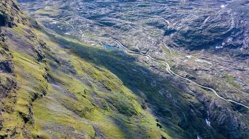 Scenic road in a Beautiful Valley with stunning views and lake, Aerial