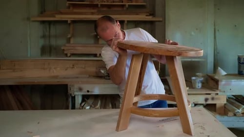 Joiner is Making Little Wooden Table in Workshop Installing Tabletop Hobby and Handmade